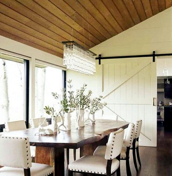 Wooden sliding door give the interior a rustic touch