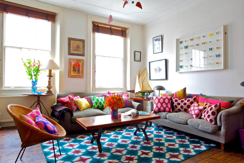 Pillows and colorful patterned carpet in a colorful room | Interior ...