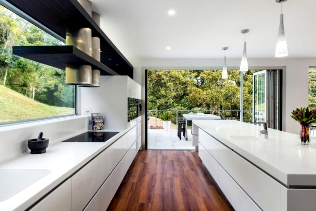 Designer Corian ® kitchen with island – Modern, open and spacious ...